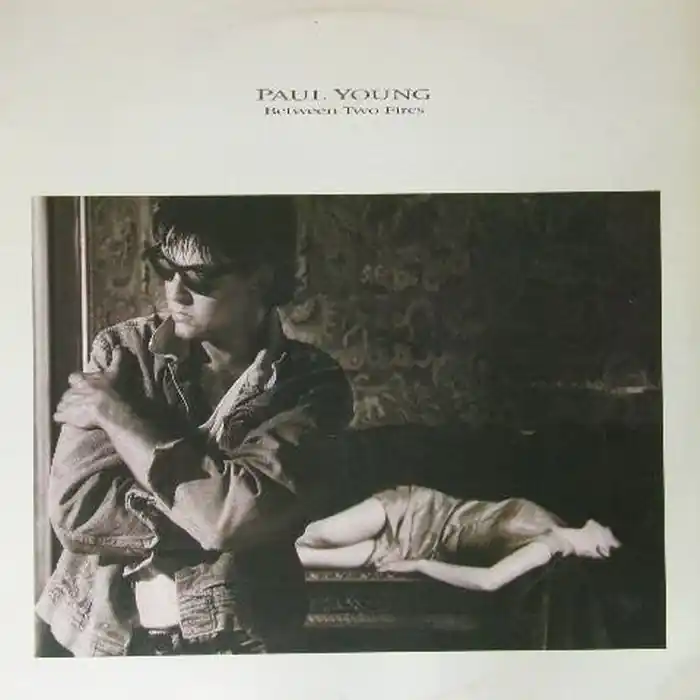 Paul Young – Between Two Fires (VG+/VG+) Worldwide Shipping